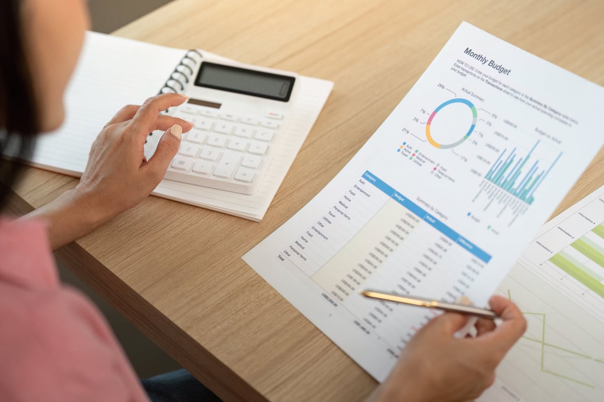 A woman reviews her monthly budget